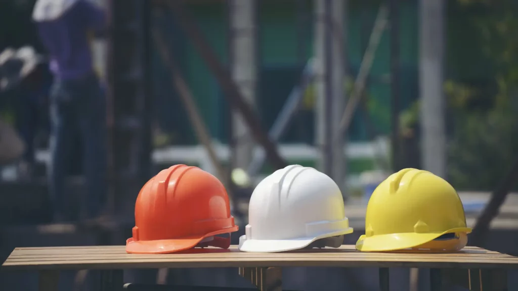 Civil construction safety - Hard hats lined up on a table